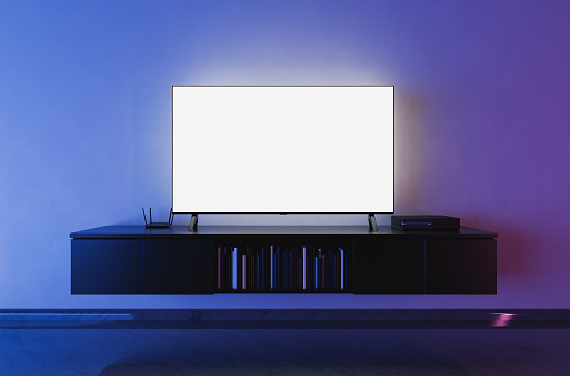 front view of a white backlit television mockup in a living room with blue and red lighting. 3d render